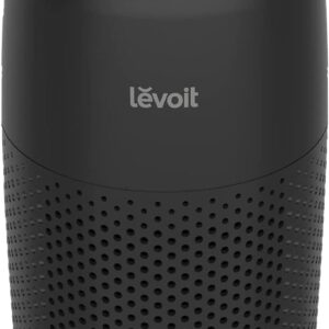 Mini air purifier in white, a small cylindrical Levoit Core Mini-P beside a bed