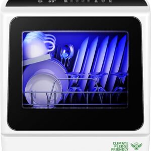 Countertop dishwasher in black standing on a kitchen worktop with the door open