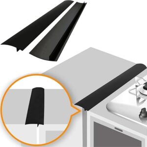 Stove gap covers in black silicone bridging the space between a hob and a kitchen worktop